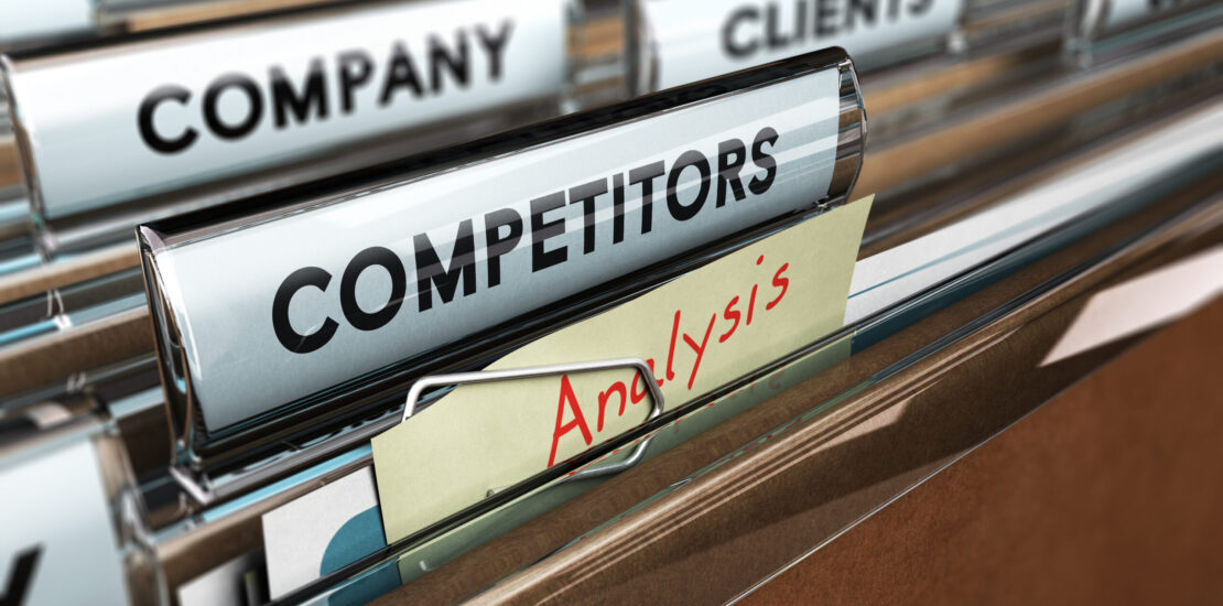 Close up on a file tab with the word competitors, focus on a yellow, note where it is hanwritten analysis, blur effect. Concept image for illustration of strategic management or business intelligence.